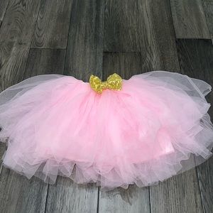 Multi layer tulle tutu with gold sequenced bow
